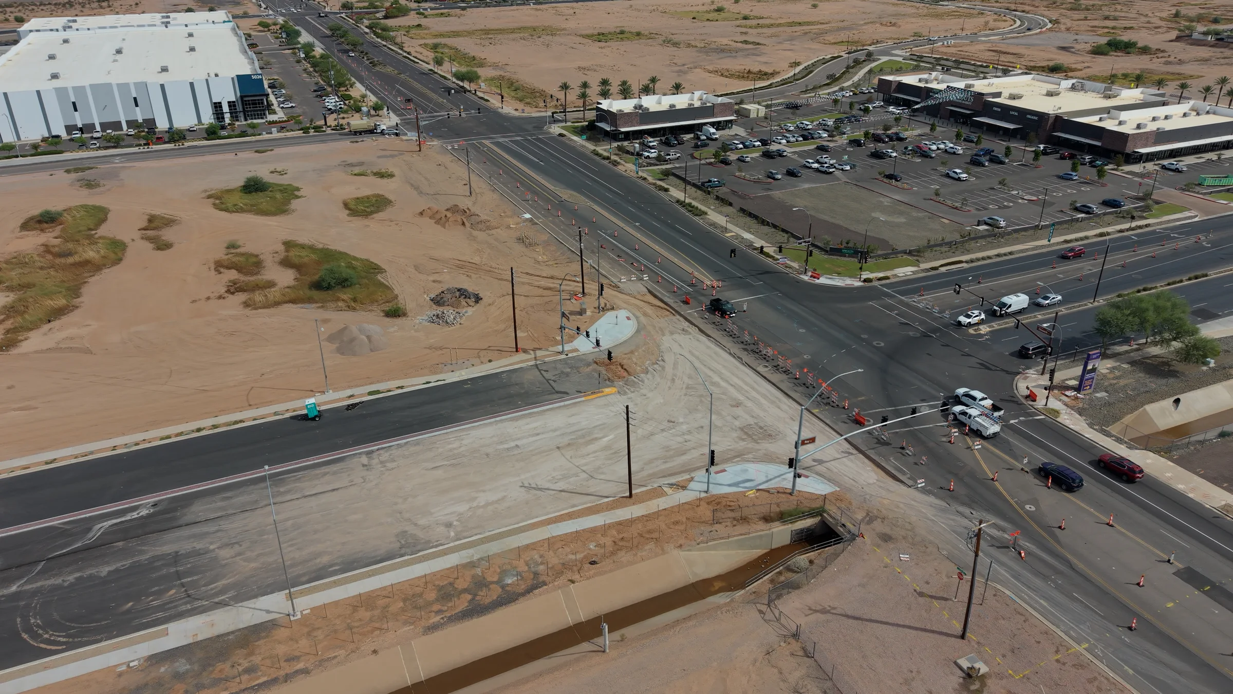 September 21 aerial view of Ray and Ellsworth roads in Mesa, with unfinished pavement, traffic cones and the Sprouts shopping center.