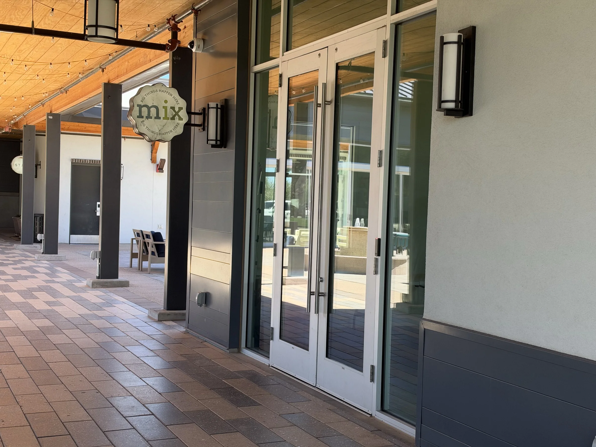 MIX event center entrance beneath a covered walkway at The Square in Cadence at Gateway.