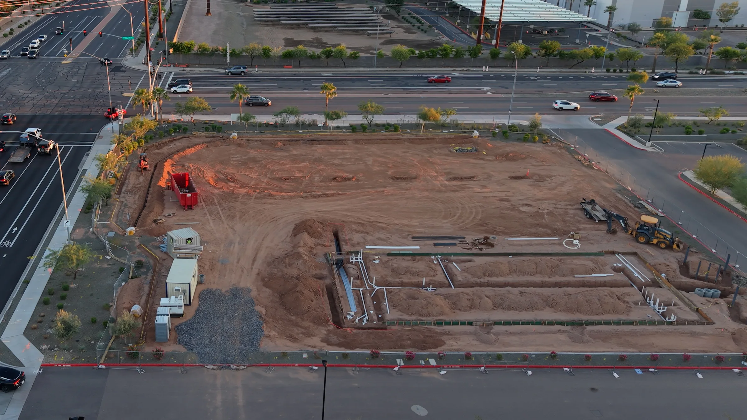 Aerial view of the Circle K construction site at Elliot and Signal Butte roads in Mesa, with graded soil, trenches, pipes and equipment.